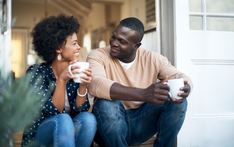 happy couple talking and having coffee