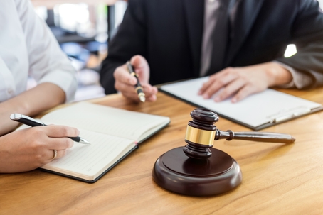 person consulting with a lawyer